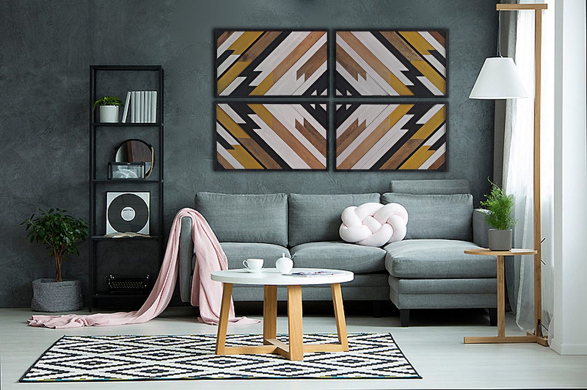 Pink blanket on sofa and round table on patterned rug in grey living room interior with poster on the wall